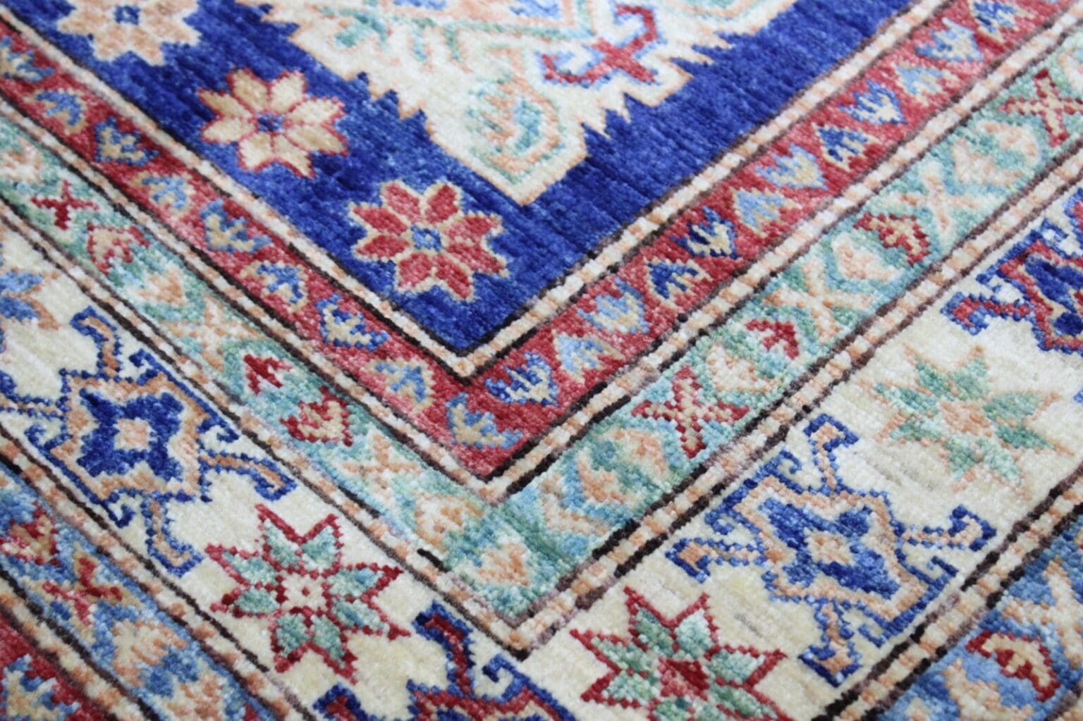 Orientteppich Kazak 242x165 cm Hochlandwolle handgeknüpft