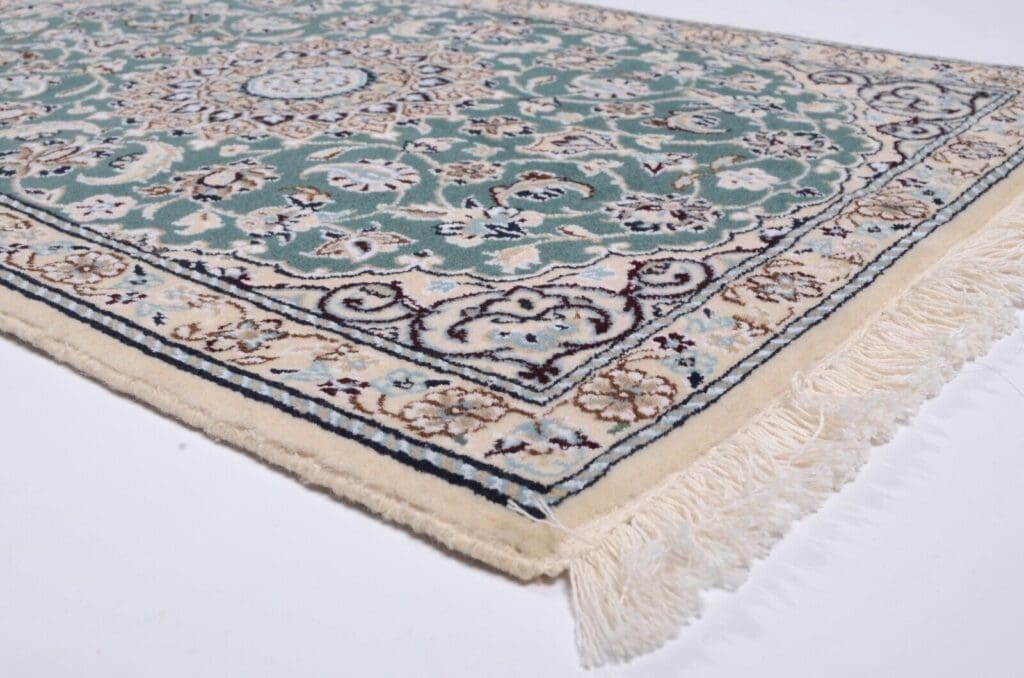 handgeknupfter-orientteppich-nain-9-94x65-cm-500000-knoten-grun-2 Perserteppich Nain 94 x 65 cm Wolle handgeknüpft