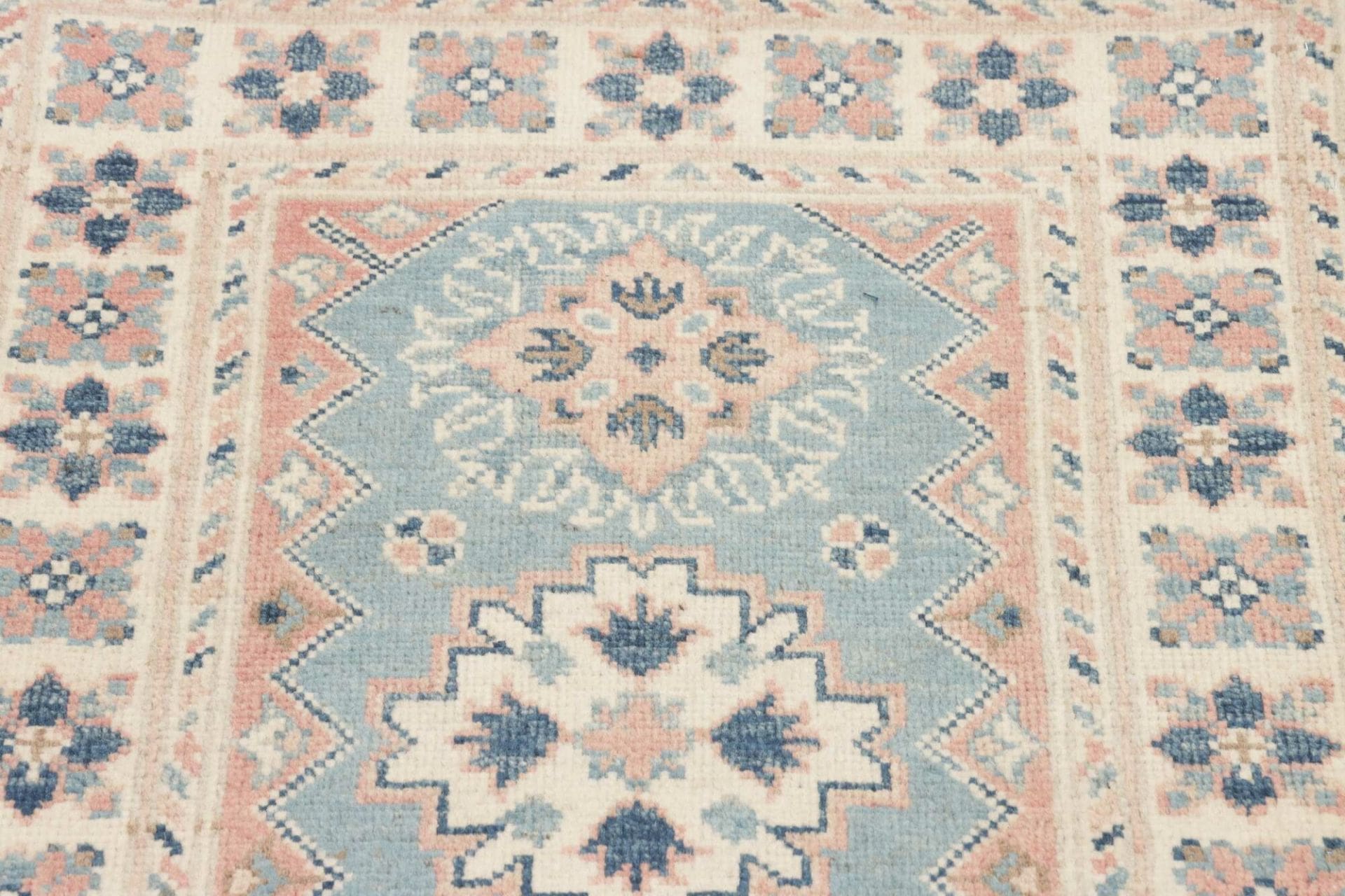 Kazak Orientteppich 66 × 92 cm aus Wolle, handgeknüpft