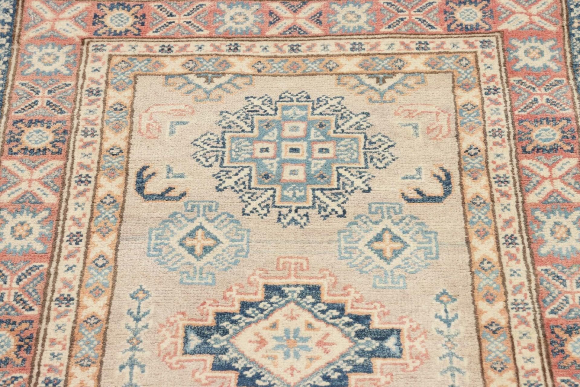 Kazak Orientteppich 80 × 127 cm aus Wolle, handgeknüpft